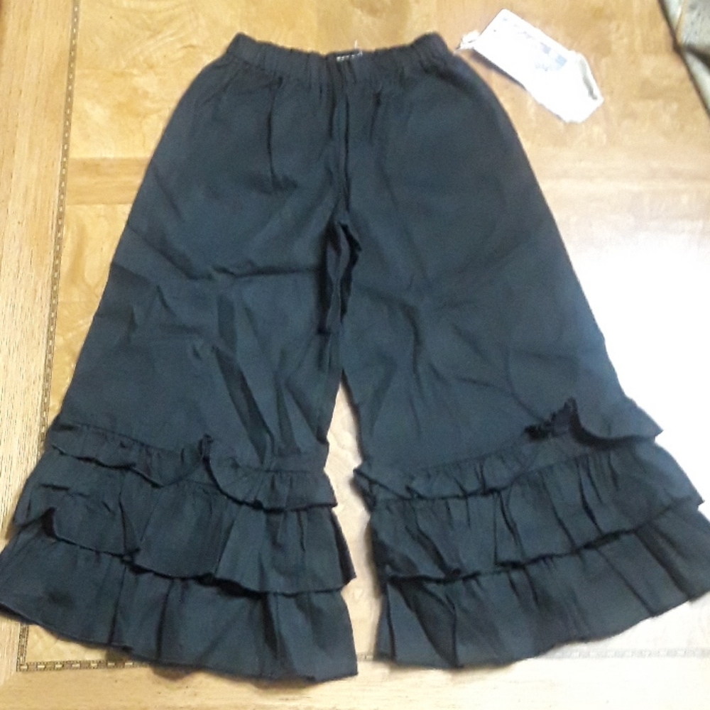 A. Bird Black Ruffle Pants